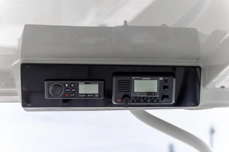 Slide: The Image of 2026 Edgewater 262 CX boat dashboard with Fusion and Garmin electronics. - 32