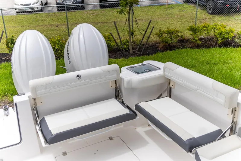 Slide: The Image of 2026 Edgewater 262 CX boat interior with white seating and Yamaha engines. - 5