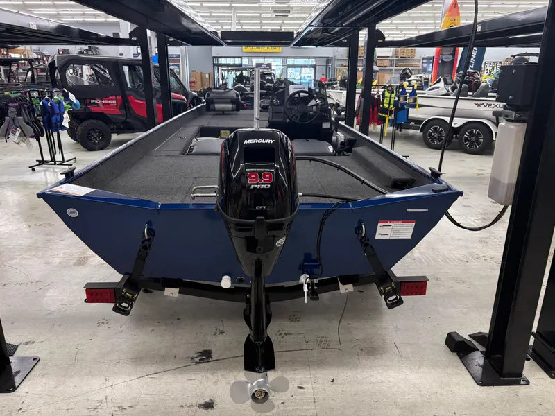 Slide: The Image of 2025 Lowe Skorpion 17 boat with Mercury 9.9 Pro motor in showroom. - 2