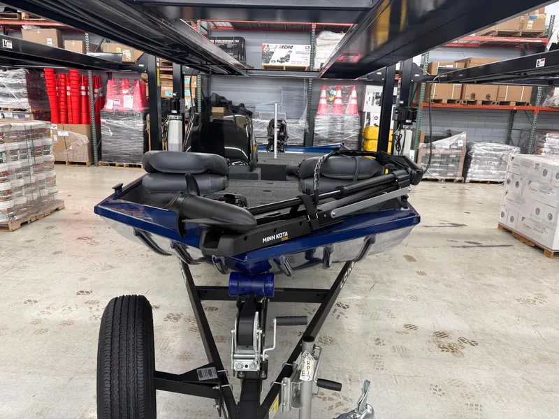 Slide: The Image of 2025 Lowe Skorpion 17 boat on trailer in warehouse setting. - 5