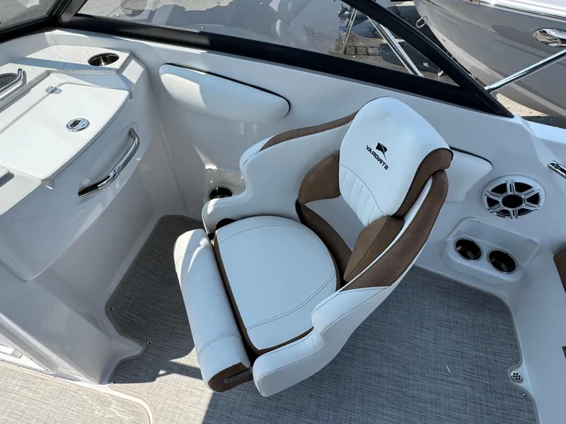 Slide: The Image of Captain's chair in 2025 Stingray 201 DC boat, featuring sleek design and modern amenities. - 10