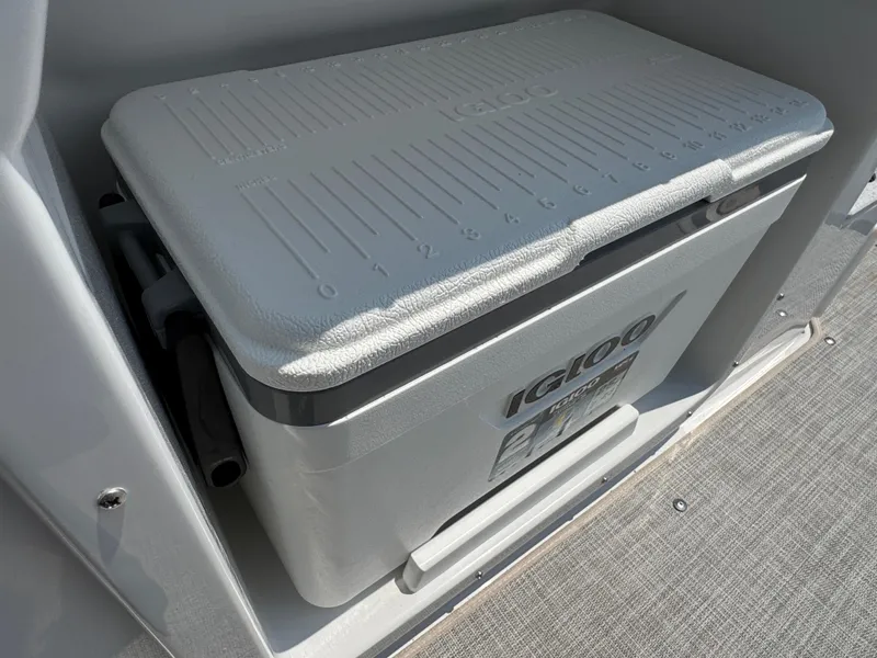 Slide: The Image of Igloo cooler on 2025 Stingray 201 DC boat, integrated storage compartment. - 12