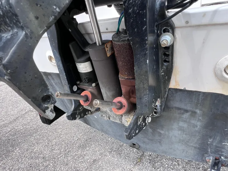 Slide: The Image of Close-up of a 2000 Pro-Line 20 WALK AROUND boat's engine mount and hydraulic components. - 10