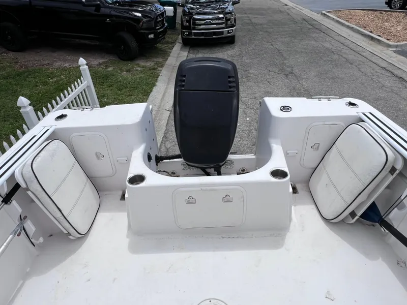 Slide: The Image of 2000 Pro-Line 20 Walk Around boat interior with seating and storage compartments. - 11