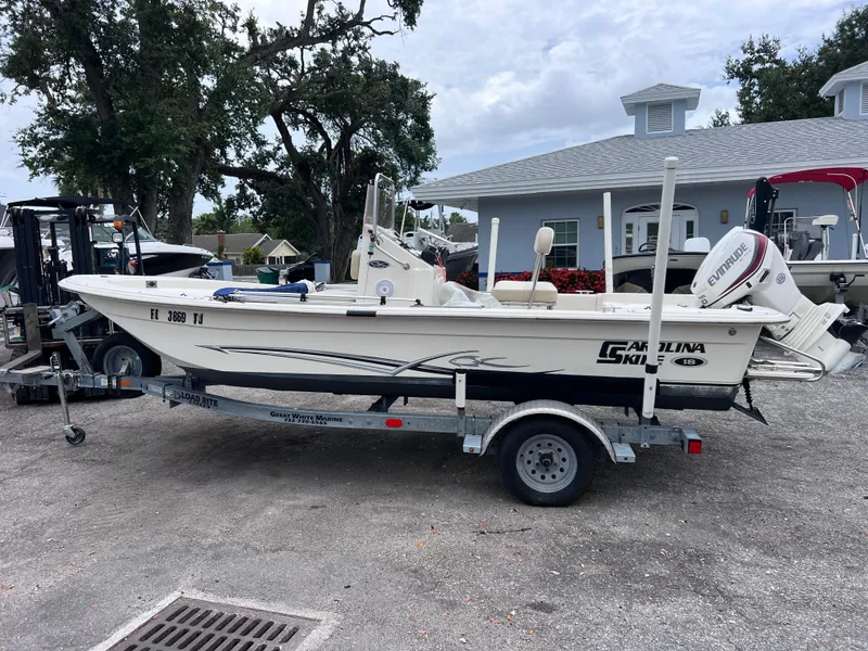 The Image of 2017 Carolina Skiff 18 JVX CC boat on trailer, parked outdoors. - 0