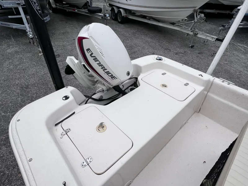 Slide: The Image of 2017 Carolina Skiff 18 JVX CC with Evinrude outboard motor, rear deck view. - 7