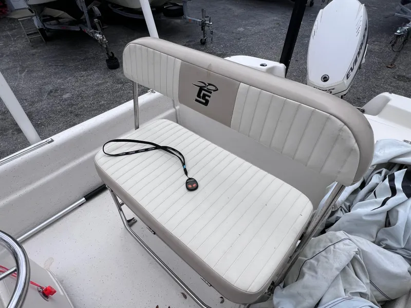 Slide: The Image of 2017 Carolina Skiff 18 JVX CC boat seat with lanyard on white cushion. - 8