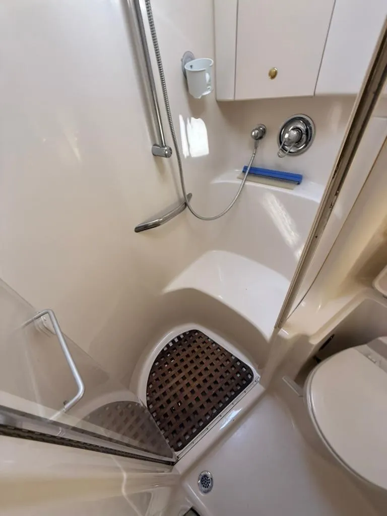 Slide: The Image of Compact bathroom in 2000 Sea Ray 380 Sundancer yacht with shower and toilet. - 14