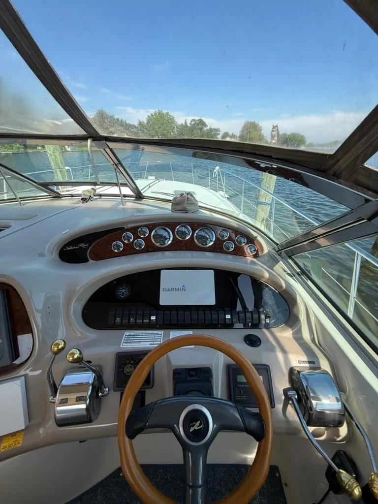 Slide: The Image of Cockpit view of 2000 Sea Ray 380 Sundancer with Garmin navigation system. - 6