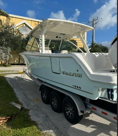 Slide: The Image of 2025 Sailfish 316 DC boat on trailer in showroom. - 4