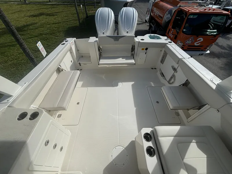 Slide: The Image of 2025 Sailfish 316 DC boat with twin Yamaha engines on a trailer. - 7