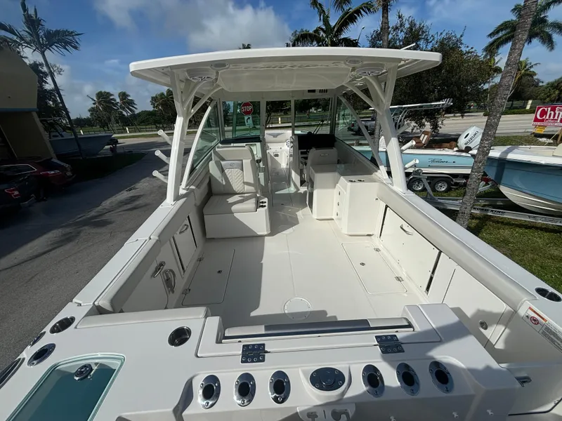 Slide: The Image of 2025 Sailfish 316 DC boat interior with seating and twin engines. - 8