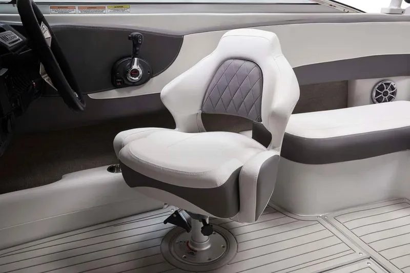 Slide: The Image of 2025 Crownline 240 SS boat interior with modern captain's chair and sleek dashboard design. - 5