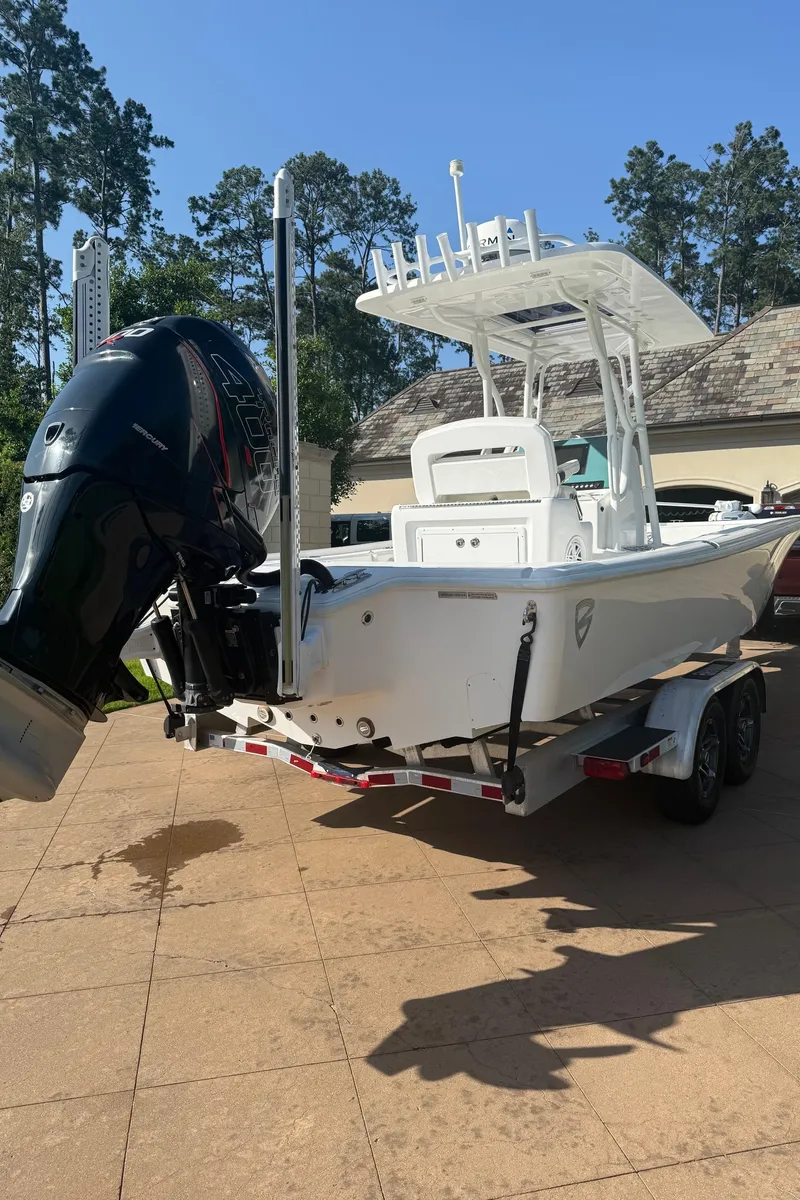 Slide: The Image of 2016 Barker Boatworks Calibouge on trailer, featuring a powerful outboard motor. - 14