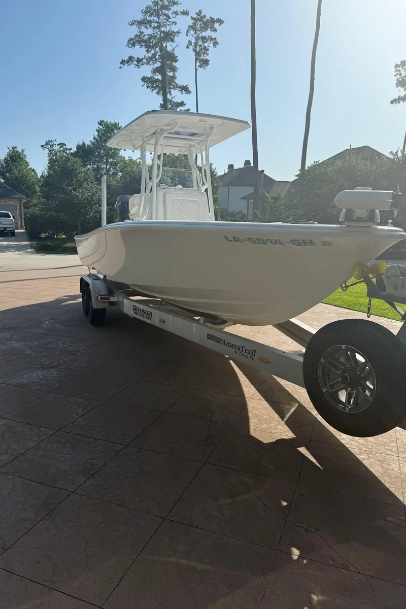 Slide: The Image of 2016 Barker Boatworks Calibouge on trailer in sunny driveway. - 15