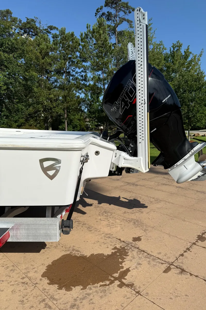 Slide: The Image of 2016 Barker Boatworks Calibouge with powerful outboard motor on a sunny day. - 21
