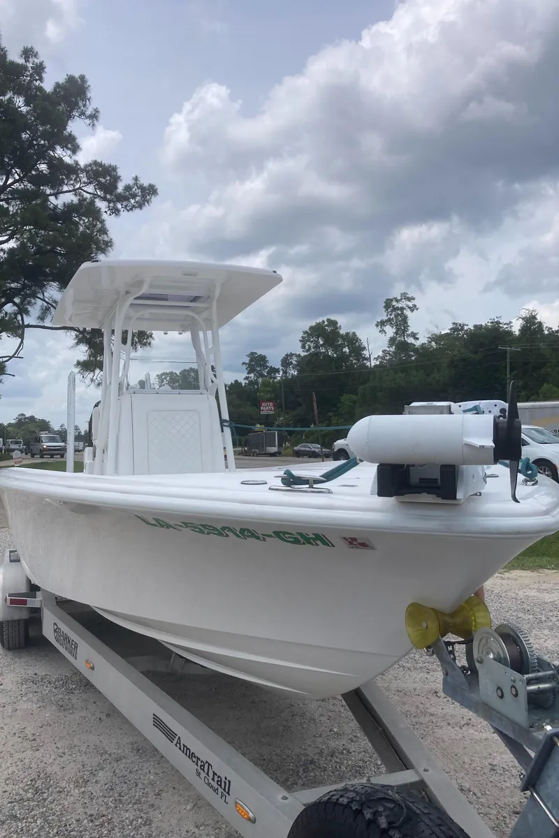 Slide: The Image of 2016 Barker Boatworks Calibouge on trailer under cloudy sky. - 23