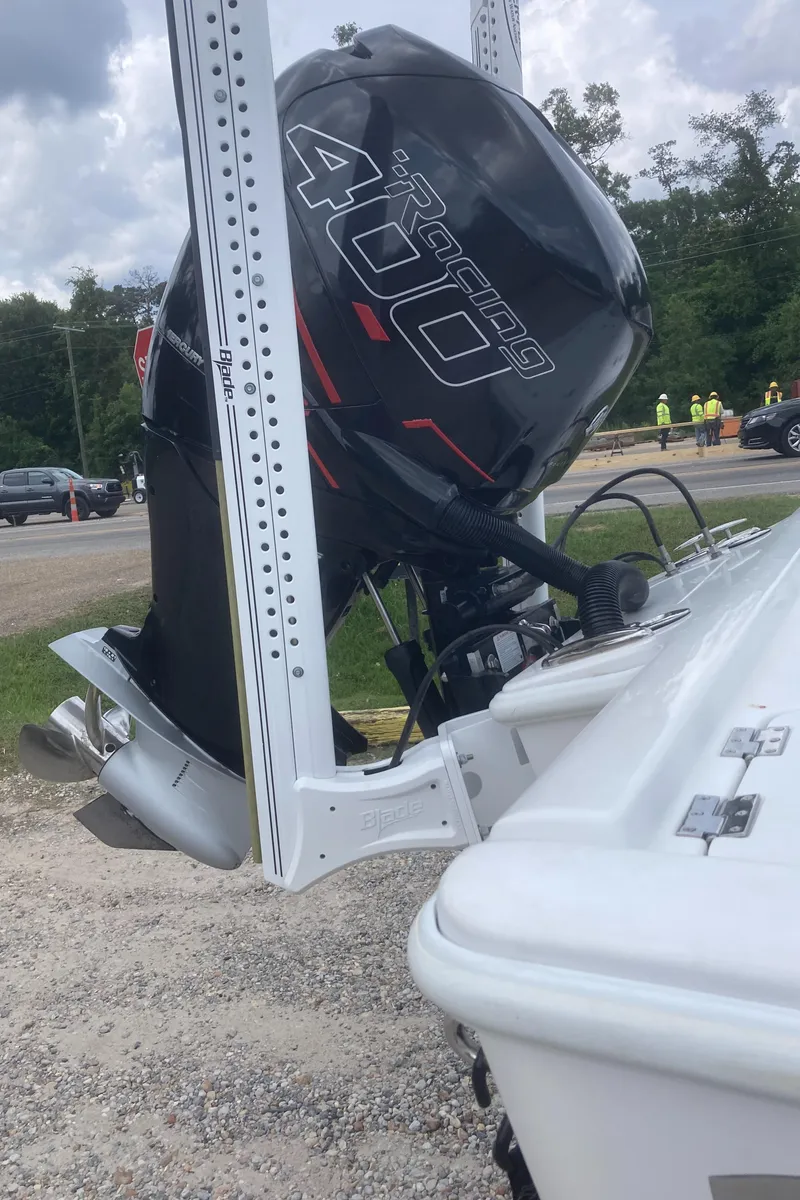 Slide: The Image of 2016 Barker Boatworks Calibouge with powerful Racing 400 engine, parked on gravel near road. - 24