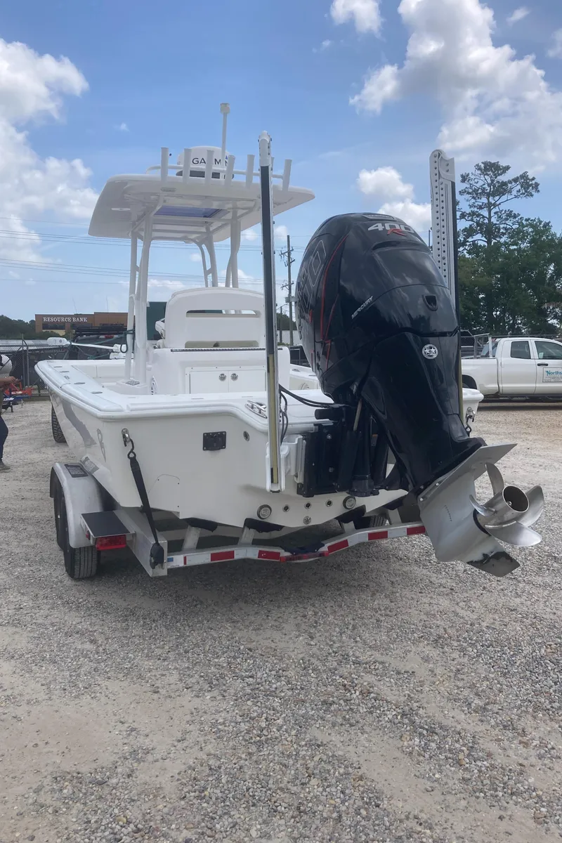 Slide: The Image of 2016 Barker Boatworks Calibouge with powerful outboard motor on a trailer. - 26