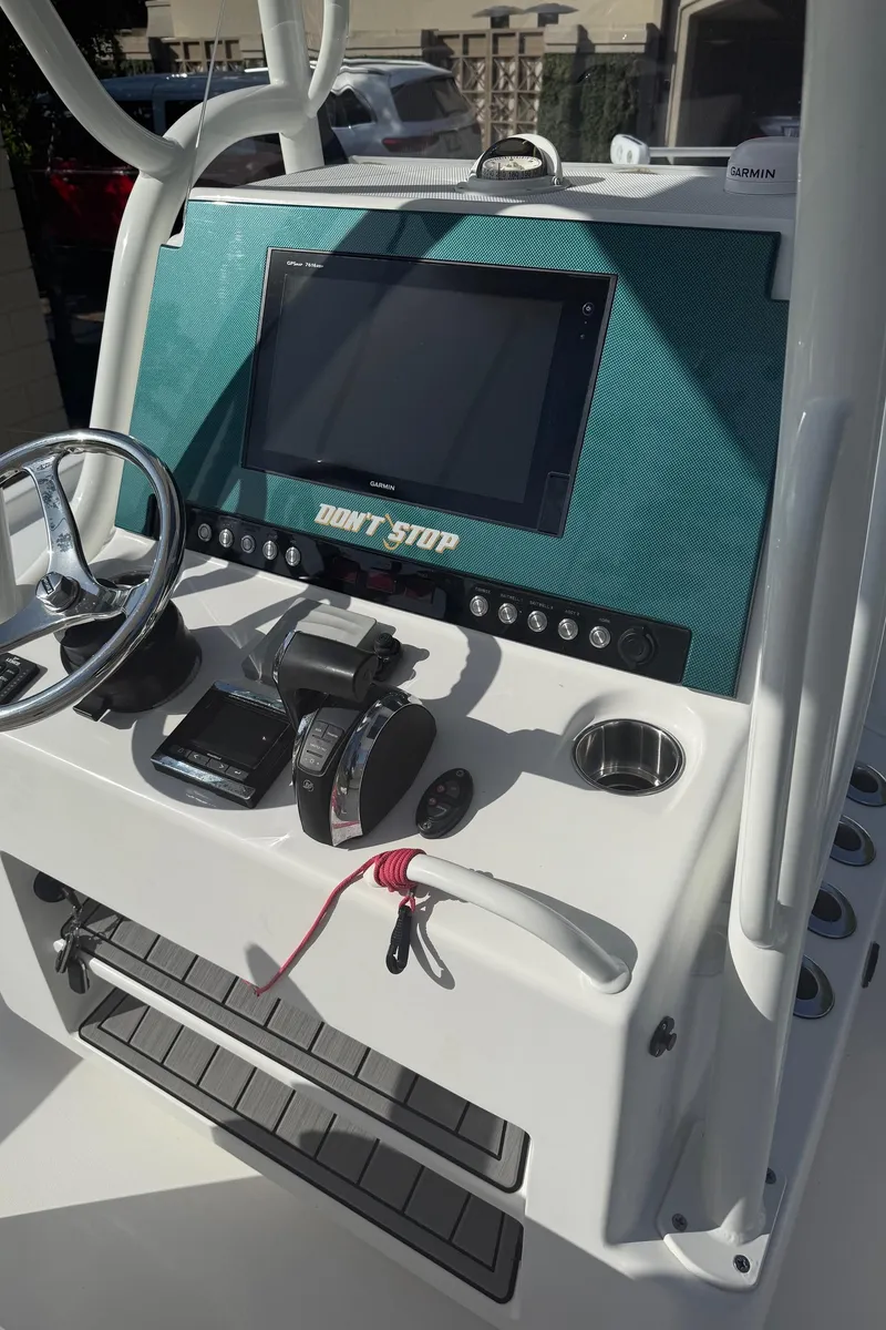 Slide: The Image of 2016 Barker Boatworks Calibouge console with steering wheel and controls. - 5