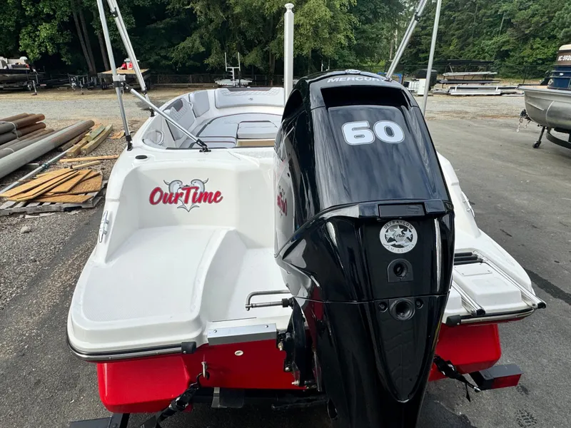 Slide: The Image of 2024 Bayliner Element M15 boat with Mercury 60 engine, docked outdoors. - 11