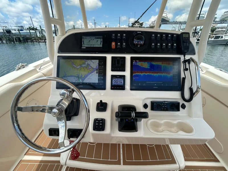 Slide: The Image of 2019 Grady-White Canyon 306 helm with advanced navigation and control systems. - 12