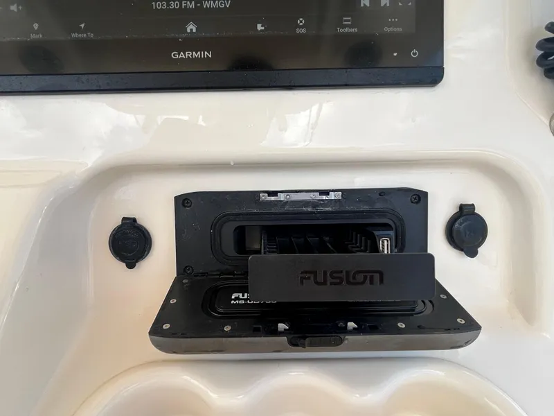 Slide: The Image of Control panel of 2019 Grady-White Canyon 306 with Garmin and Fusion audio system. - 18