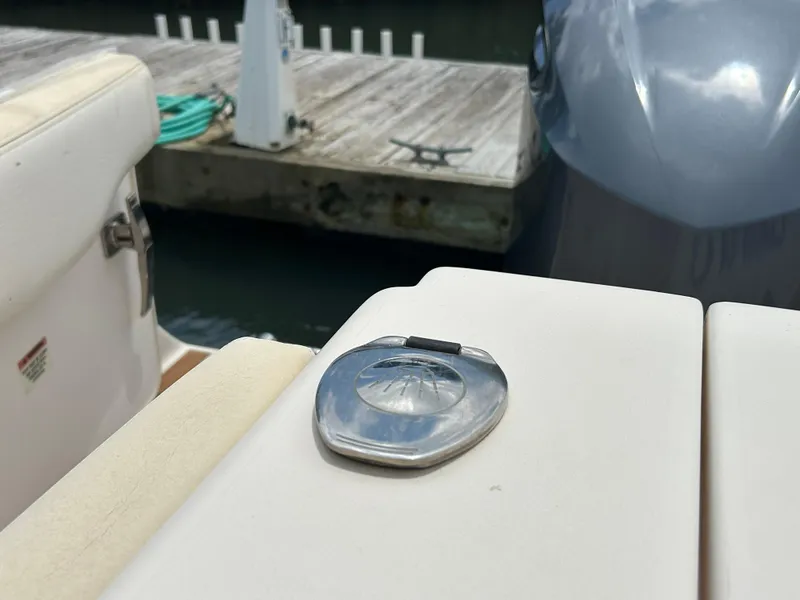 Slide: The Image of 2019 Grady-White Canyon 306 boat detail with dock in background. - 2