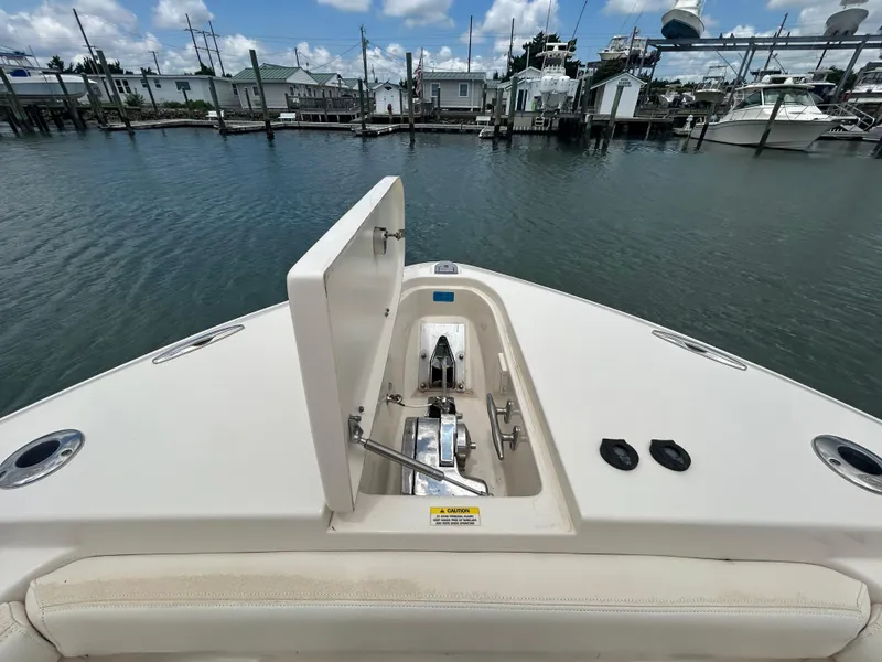 Slide: The Image of 2019 Grady-White Canyon 306 boat bow with anchor locker, docked at marina. - 26