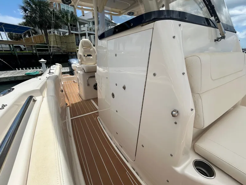 Slide: The Image of 2019 Grady-White Canyon 306 boat interior with seating and deck details. - 27