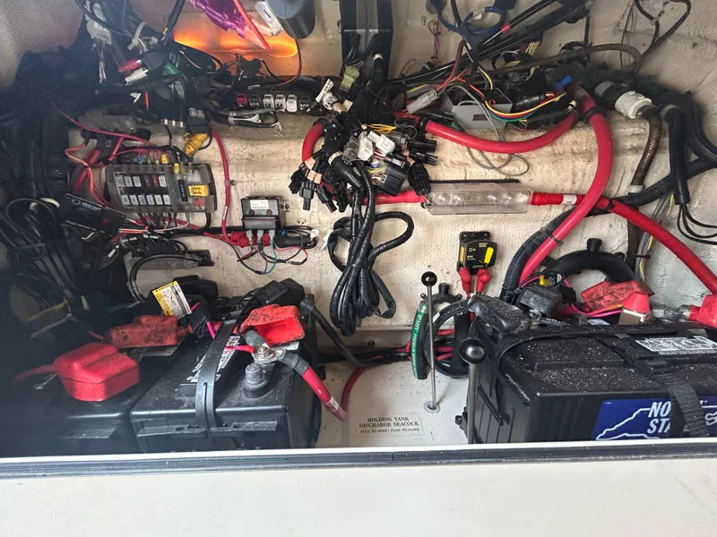 Slide: The Image of Electrical wiring and battery setup in a 2019 Grady-White Canyon 306 boat. - 30