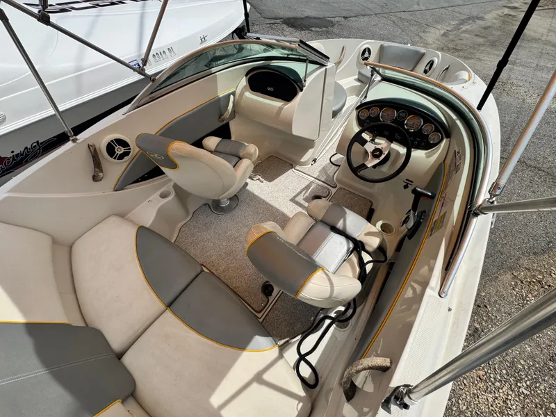 Slide: The Image of 2008 Sea Ray 185 Sport boat interior with steering wheel and seating. - 10