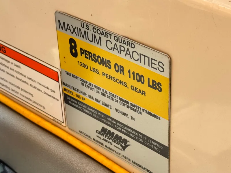 Slide: The Image of 2008 Sea Ray 185 Sport capacity label, 8 persons or 1100 lbs, U.S. Coast Guard compliant. - 12