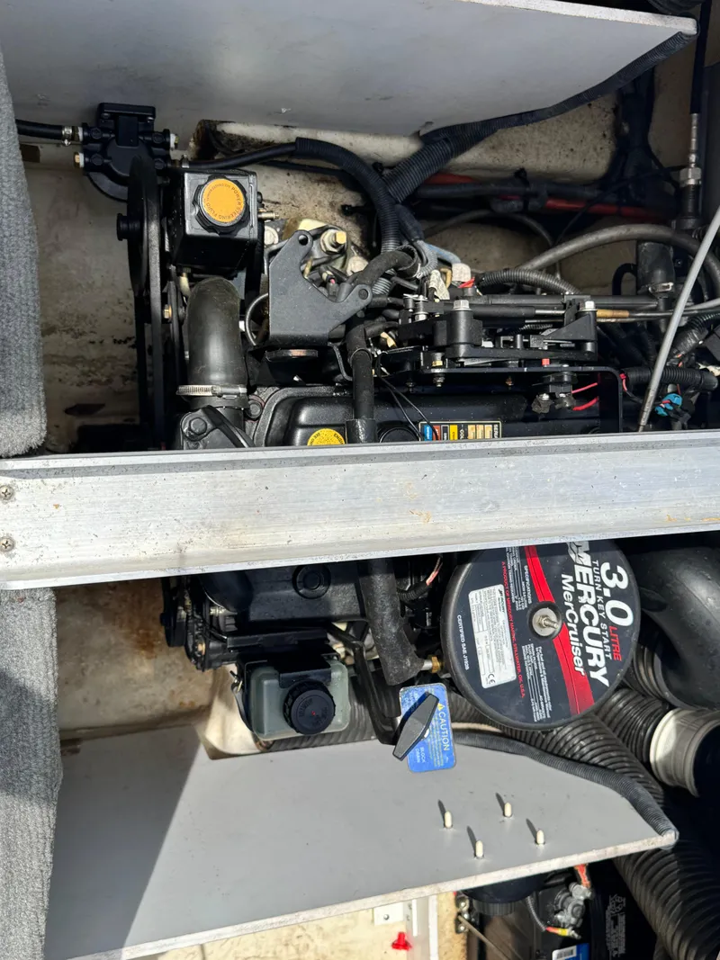 Slide: The Image of Engine compartment of a 2008 Sea Ray 185 Sport boat with Mercury 3.0 motor. - 13