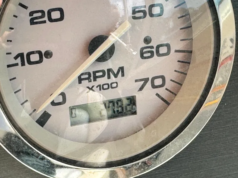 Slide: The Image of Close-up of a 2008 Sea Ray 185 Sport RPM gauge displaying 708.2 hours. - 15