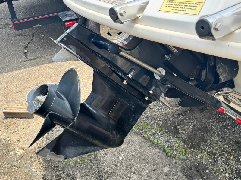 Slide: The Image of Close-up of 2008 Sea Ray 185 Sport boat propeller and outdrive on pavement. - 7