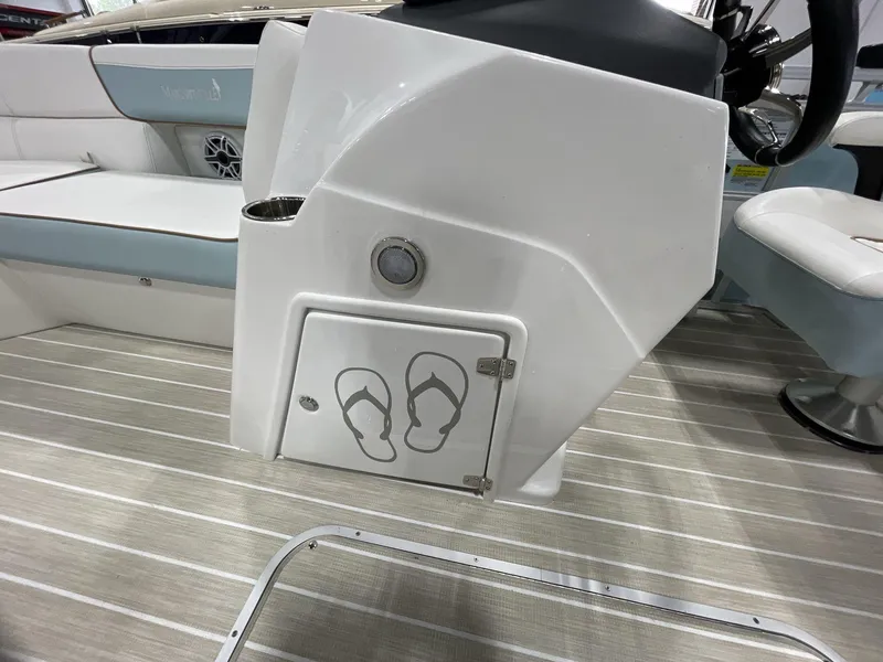 Slide: The Image of 2025 South Bay S224 Chill boat interior with flip-flop storage compartment and seating. - 15