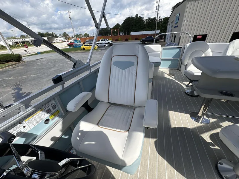 Slide: The Image of 2025 South Bay S224 Chill boat interior with plush seating and modern design. - 27