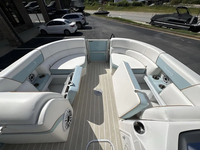 Slide: The Image of 2025 South Bay S224 Chill pontoon boat interior with spacious seating and cup holders. - 30