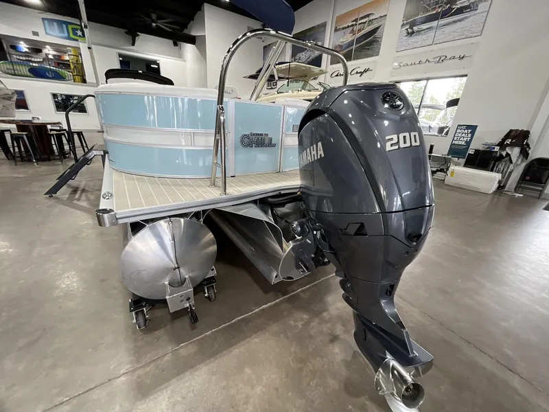 Slide: The Image of 2025 South Bay S224 Chill pontoon boat with Yamaha 200 engine in showroom. - 8