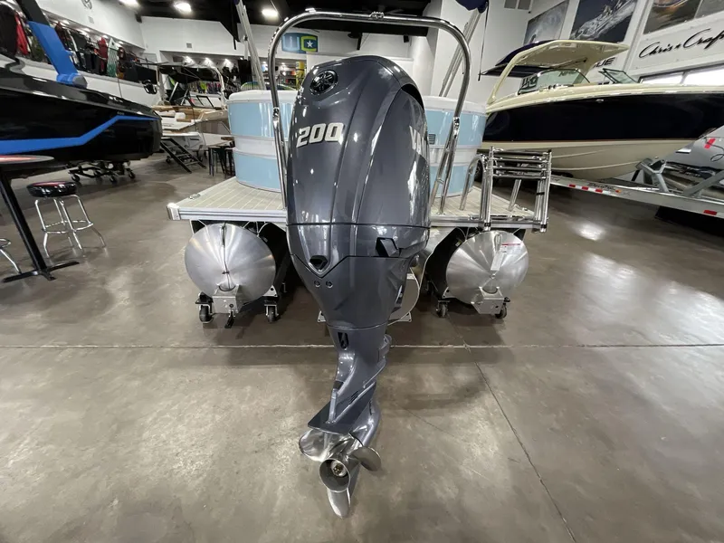Slide: The Image of 2025 South Bay S224 Chill pontoon boat with Yamaha 200 outboard motor in showroom. - 9
