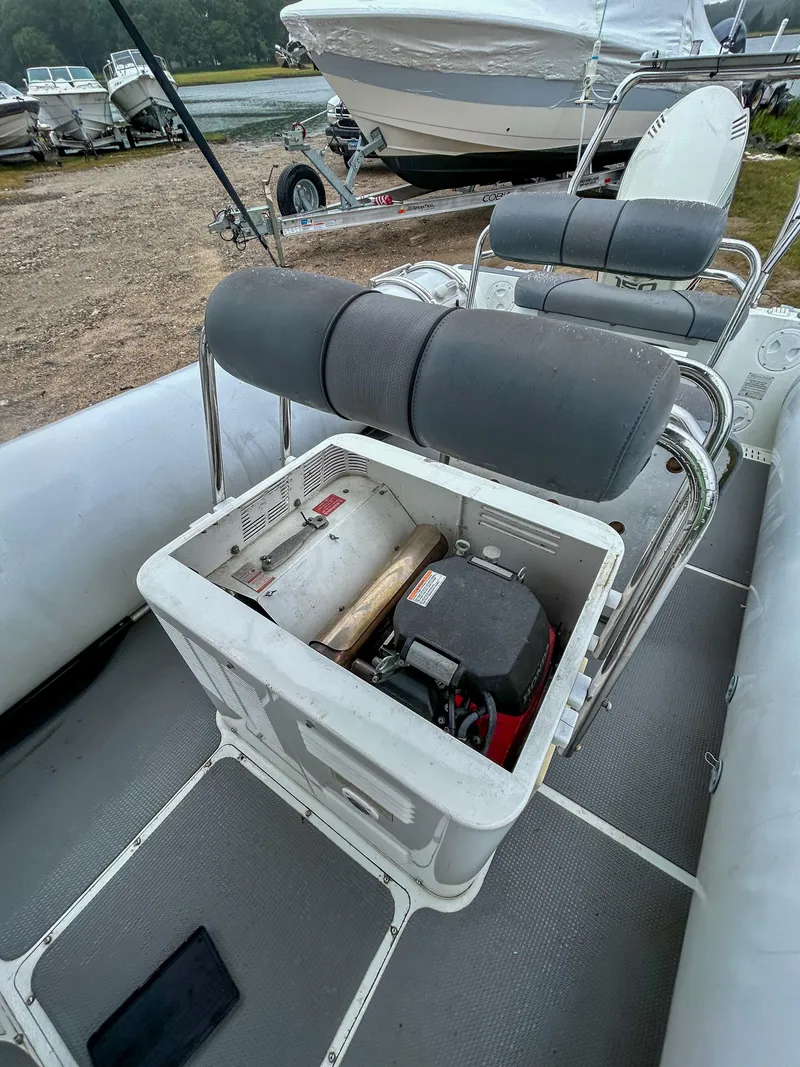 Slide: The Image of 2014 Sealegs 7.1m RIB interior showing seating and storage compartment. - 10