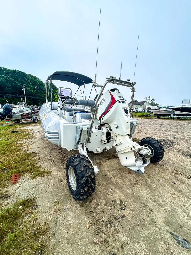 Slide: The Image of 2014 Sealegs 7.1m RIB with wheels on sandy terrain, ready for amphibious use. - 3