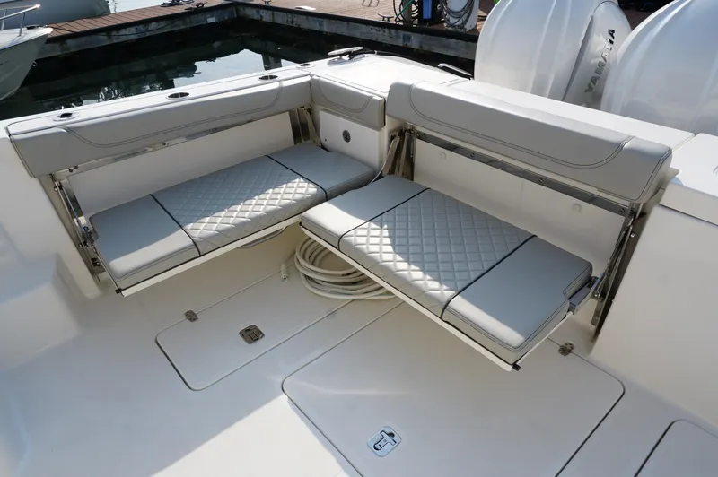 Slide: The Image of 2023 Pursuit OS 355 Offshore boat with foldable seating and Yamaha engines. - 16