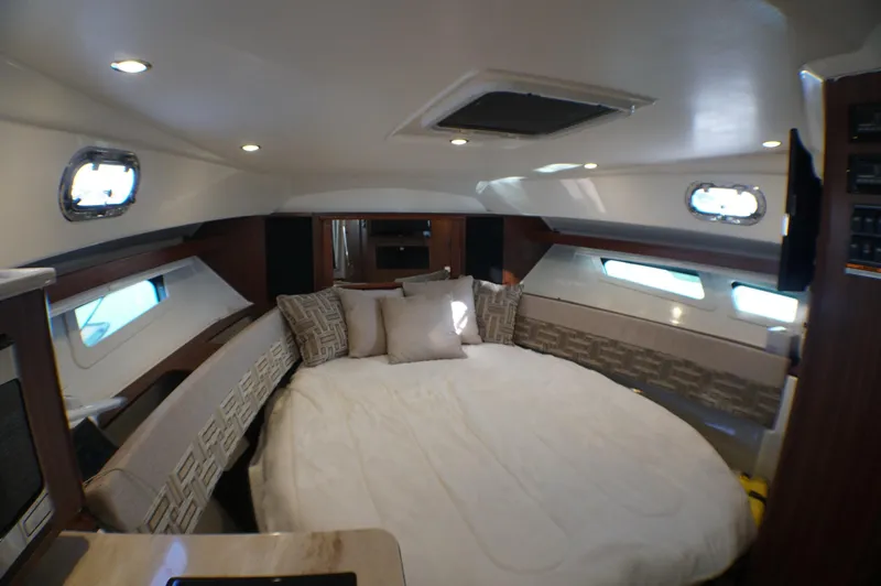 Slide: The Image of 2023 Pursuit OS 355 Offshore cabin interior with cozy bed and modern design. - 48