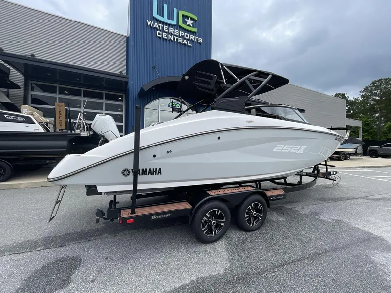Slide: The Image of 2024 Yamaha Boats 252XE displayed at Watersports Central dealership. - 10