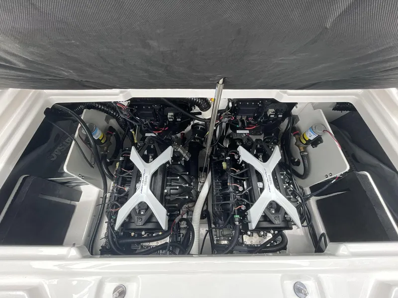 Slide: The Image of 2024 Yamaha Boats 252XE engine compartment showcasing dual engines and intricate wiring. - 19