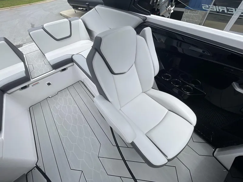 Slide: The Image of 2024 Yamaha Boats 252XE interior with sleek white seating and modern design. - 24