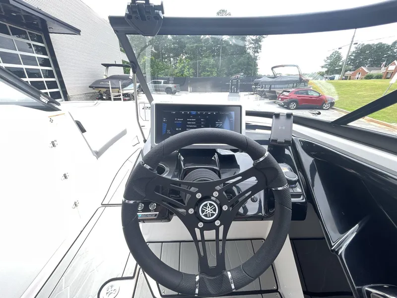 Slide: The Image of 2024 Yamaha Boats 252XE dashboard with steering wheel and digital display. - 28