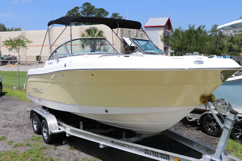 Slide: The Image of 2008 Robalo R227 Dual Console boat on trailer, parked outdoors. - 1